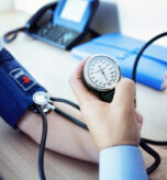 Doctor checking the blood pressure of a patient
